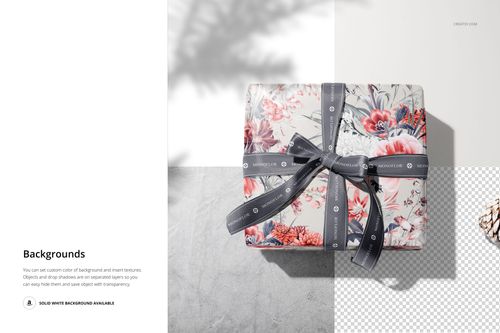 Floral gift box with gray ribbon displayed on a split background, featuring a PSD mockup for packaging design.