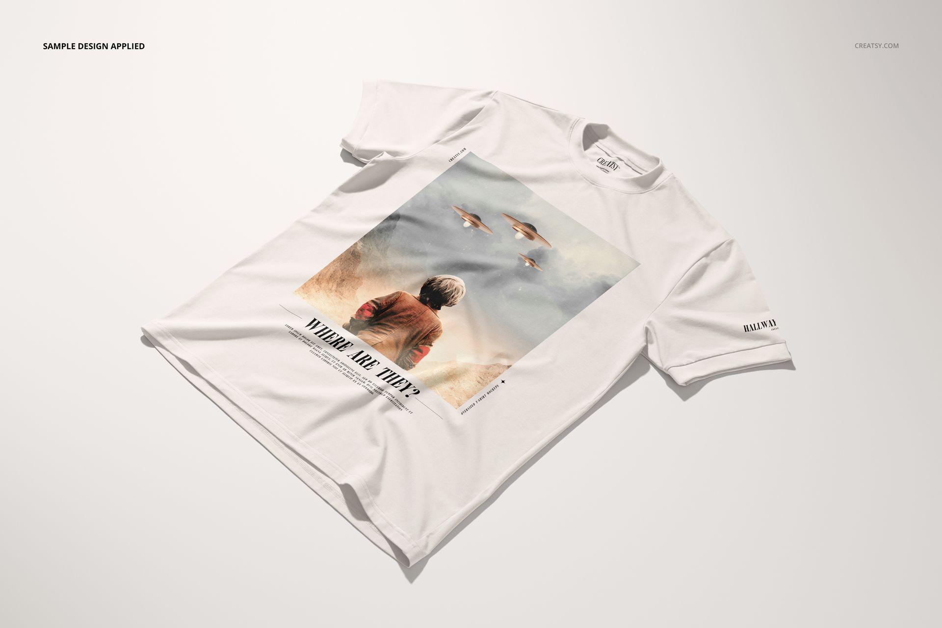 Oversized white t-shirt mockup displayed at an angle, featuring a printed graphic of a person and flying objects.