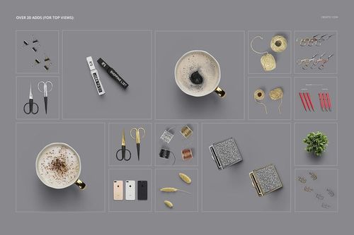 Top view of planner mockup set with coffee cups, scissors, pens, wire spools, notebooks, and small plant on gray background.
