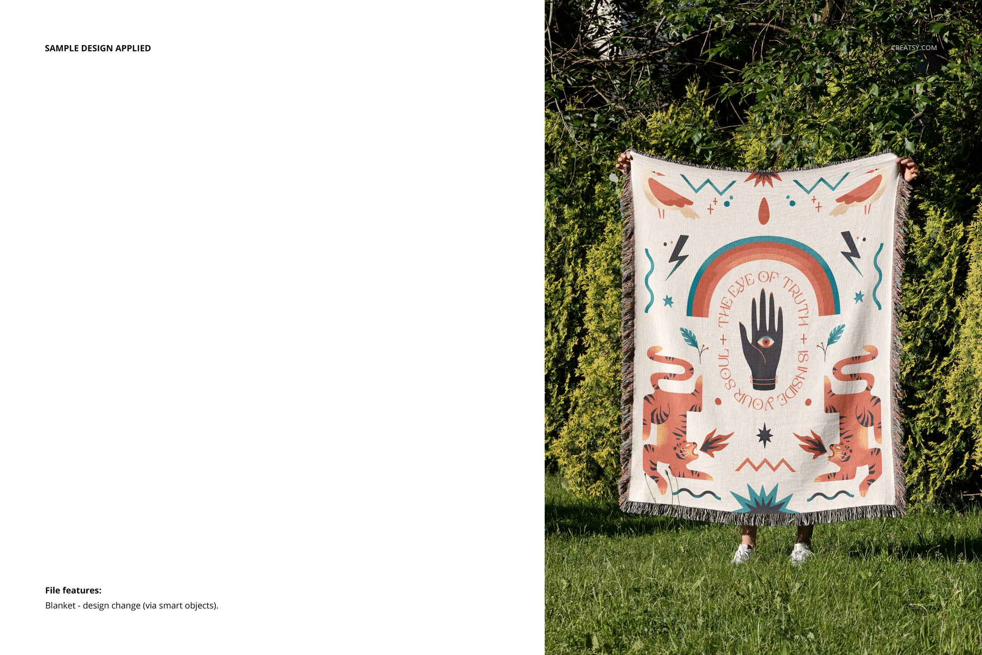 Jacquard fringed throw blanket mockup displayed vertically on grass with geometric and hand motifs, outdoor scene.