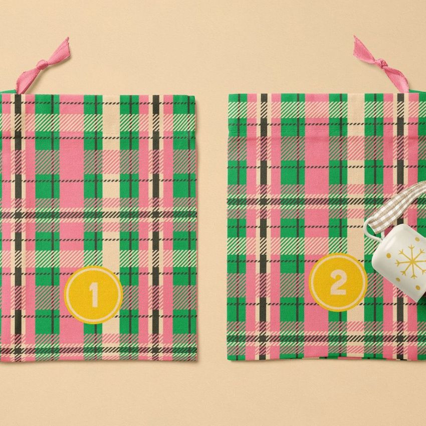 Drawstring sacks advent calendar mockup featuring two flat plaid fabric bags with yellow numbered circles on a beige surface.