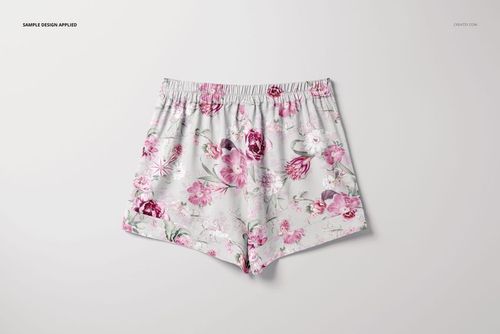 Short silk pajama mockup featuring floral pink and white design, shown from above on a plain light surface.