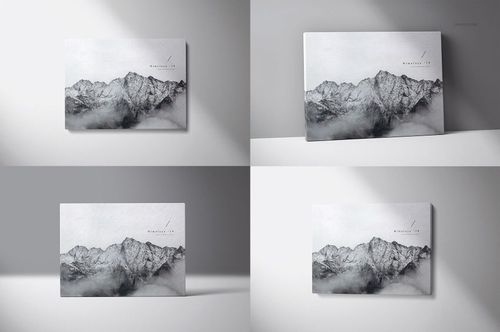 PSD mockup showing multiple canvas prints with a misty mountain scene, presented in various wall-mounted positions.