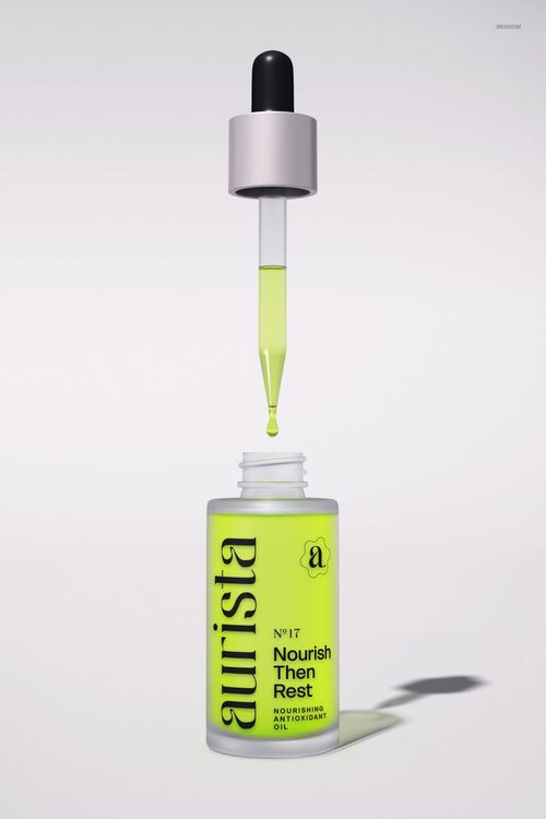 Cosmetic dropper bottle mockup featuring a bright yellow label, black cap, and pipette held above the bottle.