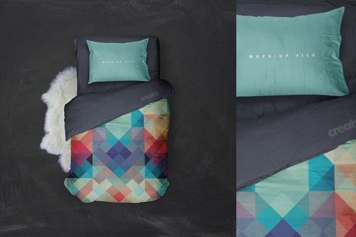 Top view of a single bed mockup featuring a colorful diamond-patterned duvet and solid teal pillow on a dark background.