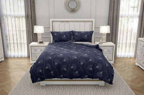 Mockup of a modern bedroom set with patterned navy blue duvet and pillows, flanked by lamps and white nightstands.