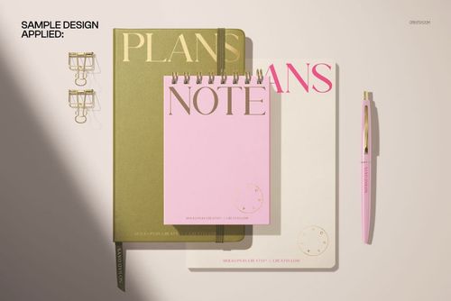 Top view of a spiral notepad, leather planner, and notebook mockup with gold, pink, and white covers on a light surface.