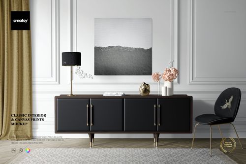Front view of a canvas print mockup on a white wall above a black sideboard, with gold lamp, vases, and chair.