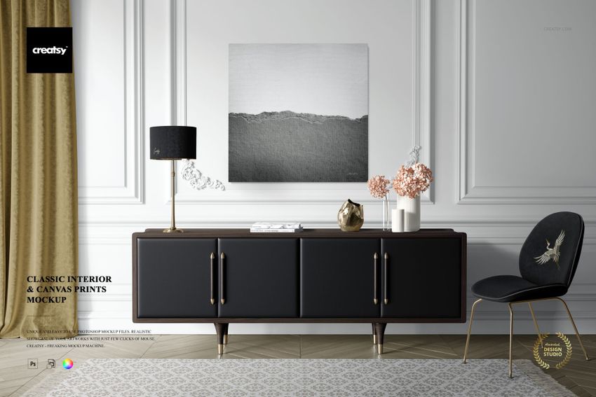 Front view of a canvas print mockup on a white wall above a black sideboard, with gold lamp, vases, and chair.