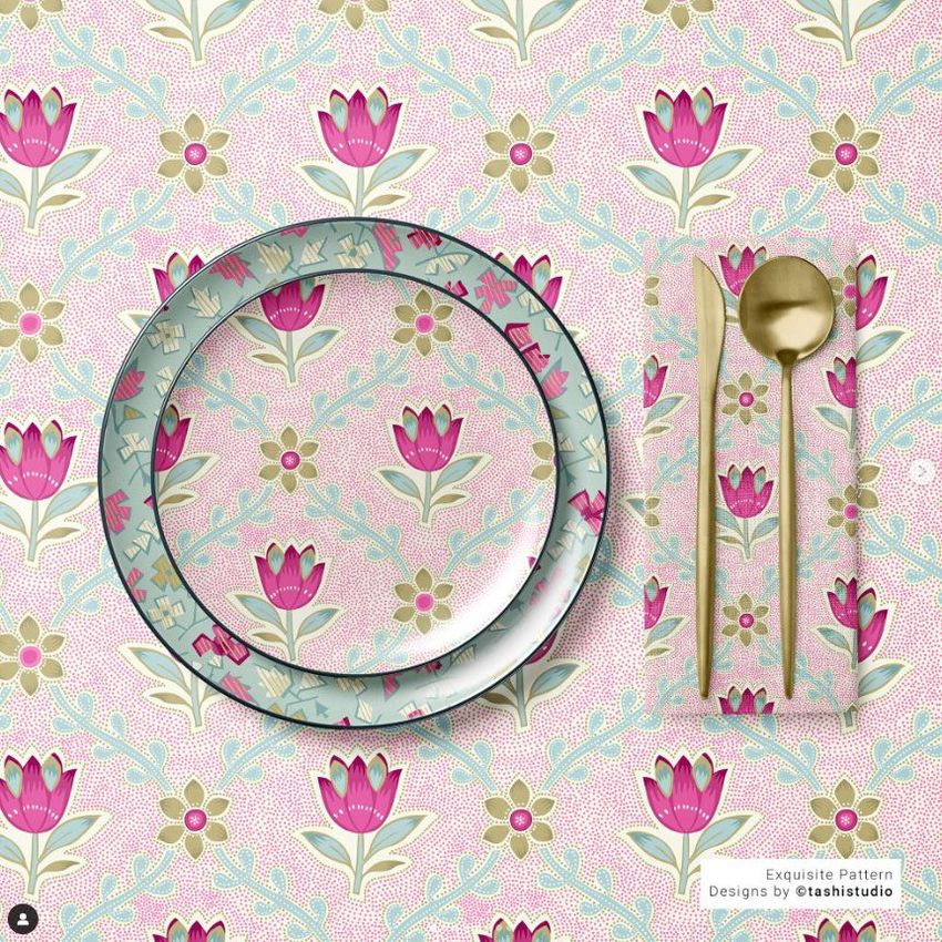 Placemat napkin plate mockup showing a floral pattern with pink and cream flowers, gold cutlery, and a decorative background.