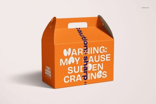 Narrow semi-transparent duct tape mockup wrapped around an orange cardboard box with bold white text, front view.