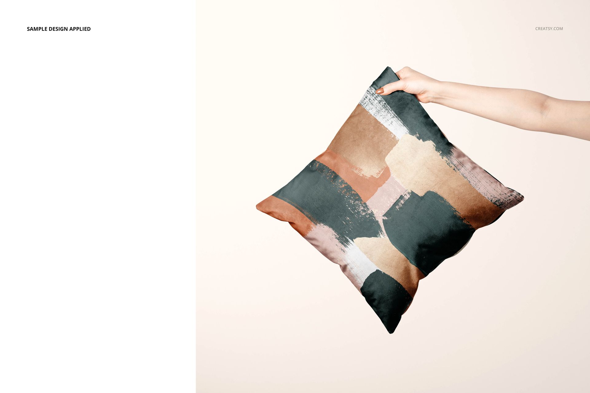 Mockup of a square cushion cover with artistic pattern, shown in a neutral setting with a person’s hand grasping one corner.