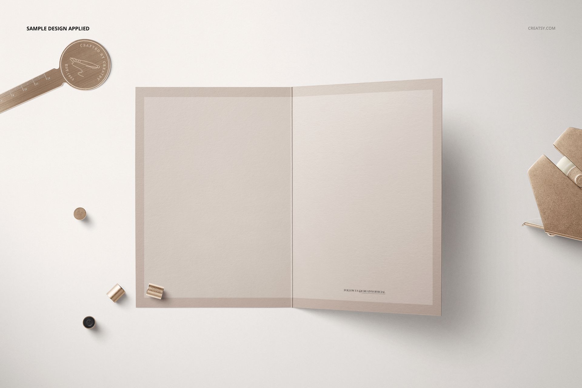 Open folded card mockup displayed on a light surface, showing blank inner pages with neutral beige tones.