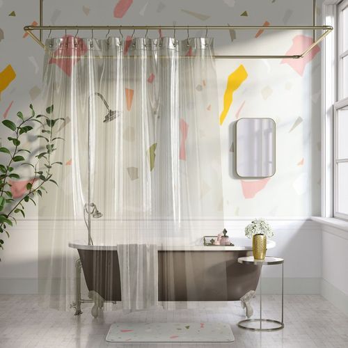 Transparent shower curtain mockup in a bright bathroom with terrazzo-patterned wall, freestanding tub, and potted plant.