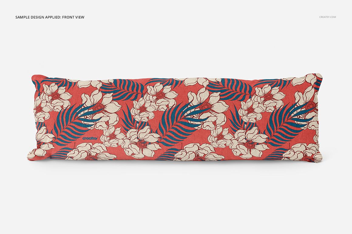 Front view of a rectangular pillow featuring cream flowers and blue leaves on a red surface, mockup presentation.