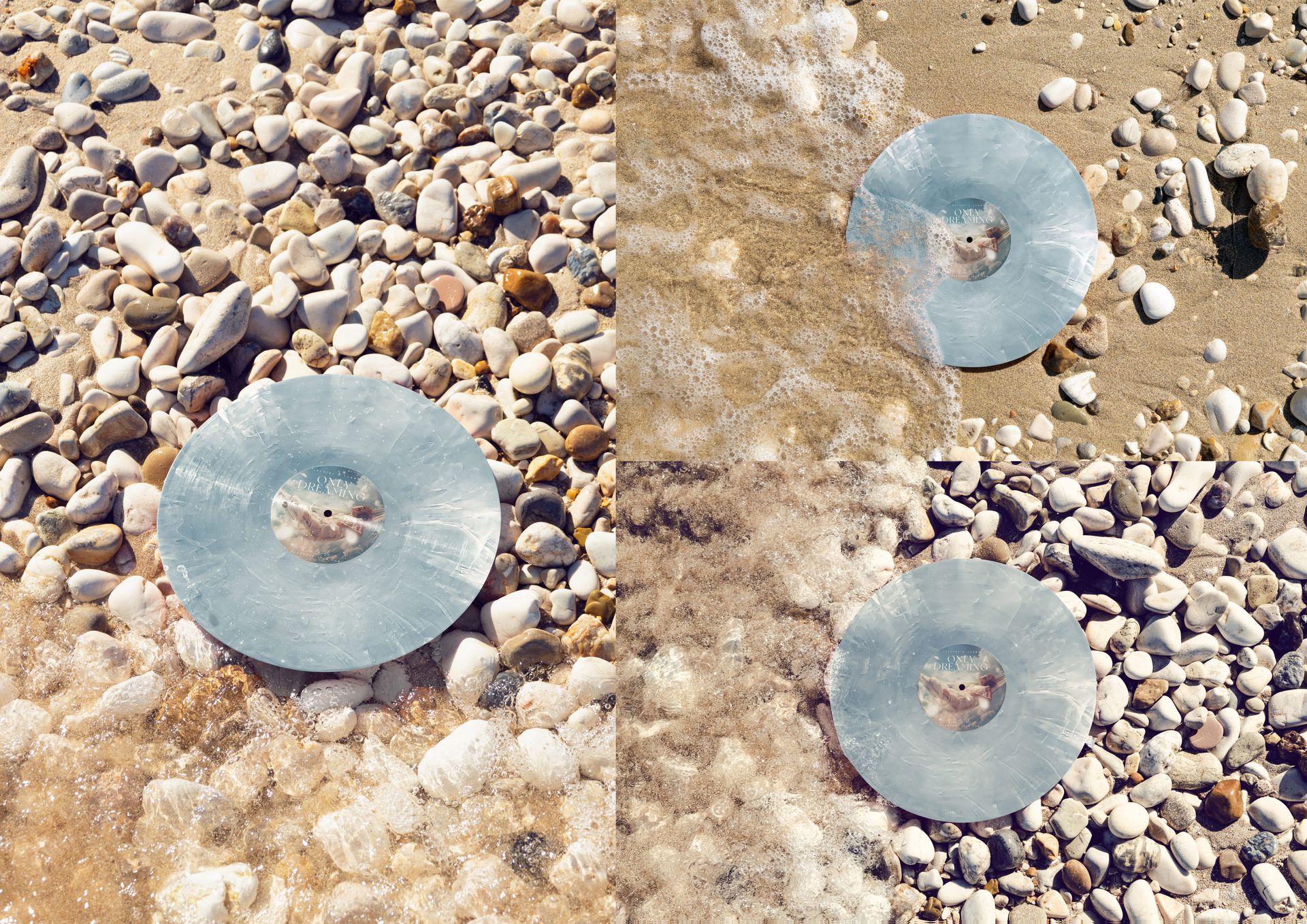 Colored vinyl record mockup set on a sunlit pebbled shore, partially touched by gentle waves and wet sand.