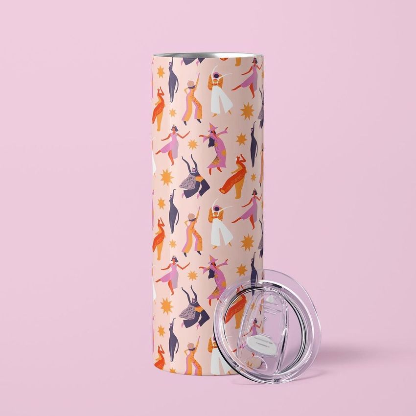 Skinny tumbler mockup featuring a seamless Halloween-themed pattern with dancing figures and stars on a light pink background.