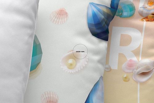Front view of a mockup set with three pillows, each displaying different seashell and abstract patterns in soft colors.