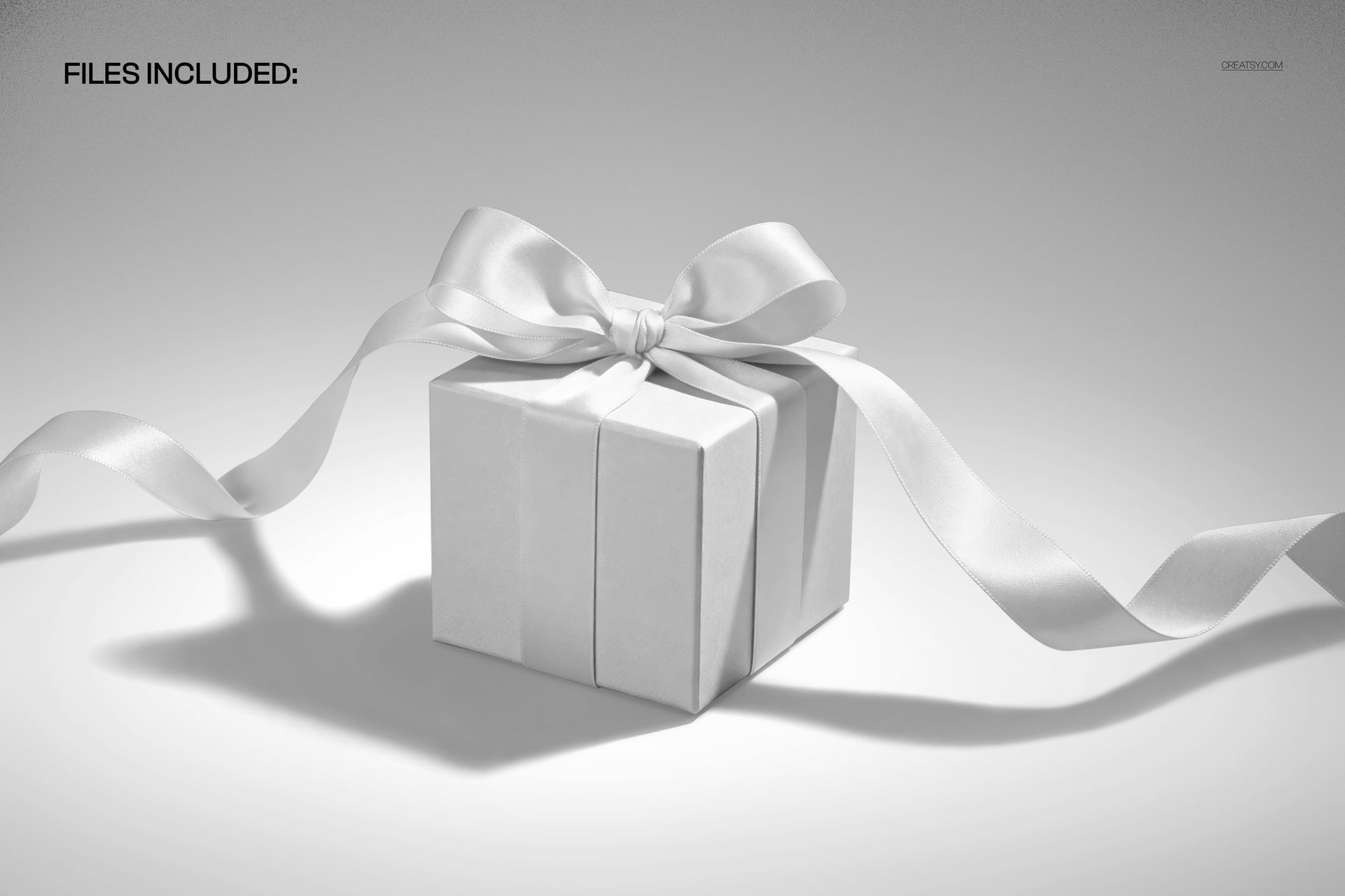 Cube gift box mockup featuring a neat white wrapping and an elegant wide ribbon tied in a bow, shown on a plain background.