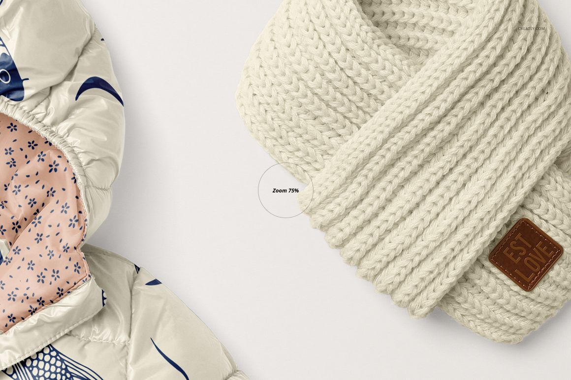 Front view of a kids winter set mockup featuring a cream knitted scarf and a patterned jacket with floral lining.