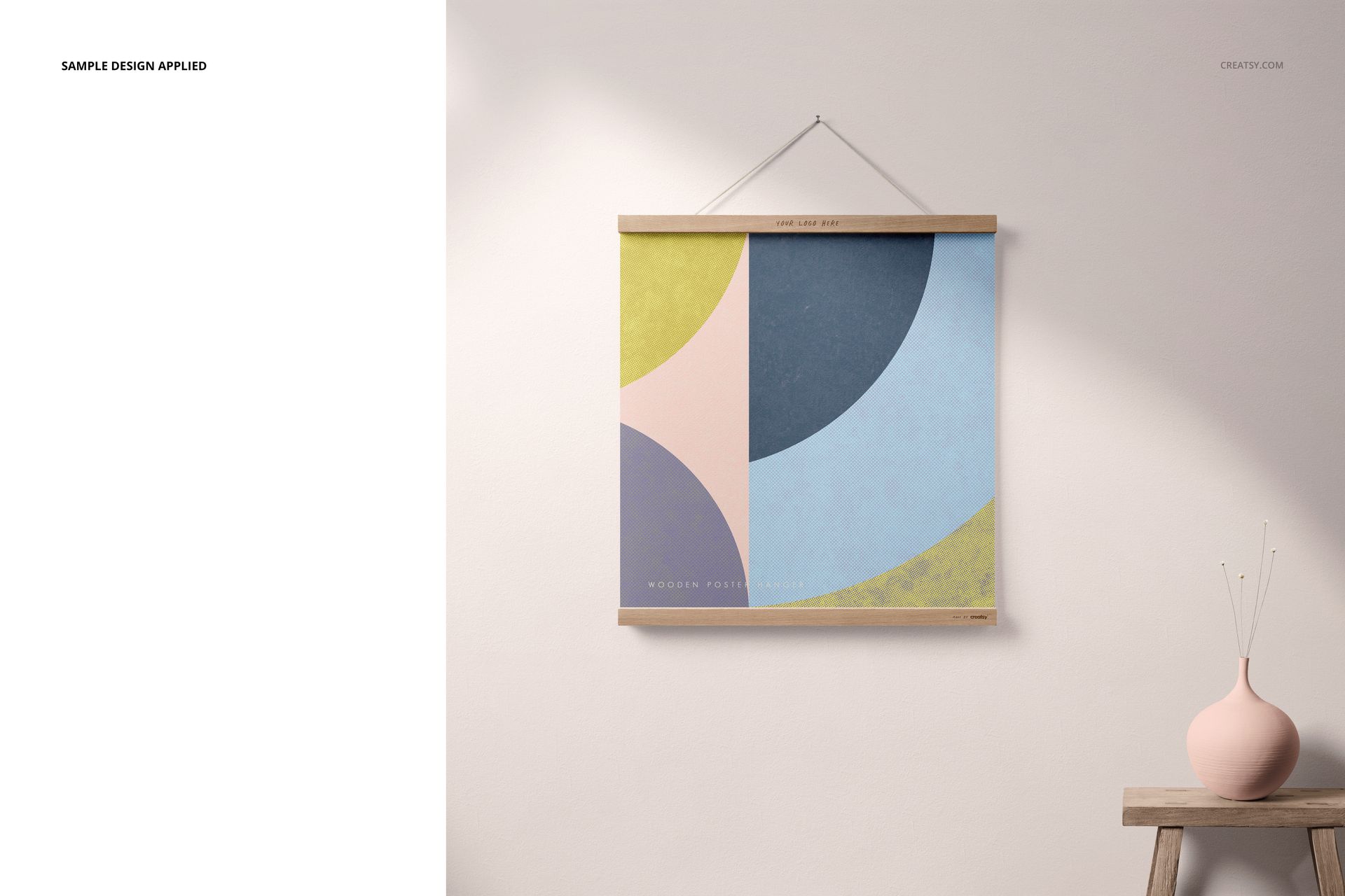 PSD mockup showing a wooden poster hanger with a colorful abstract print, next to a small vase on a minimalist shelf.