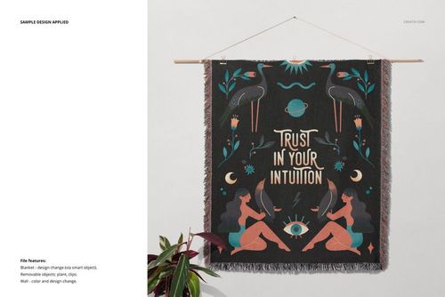 Fringed woven throw blanket mockup hanging on a wooden rod, featuring a colorful geometric and nature-inspired design.