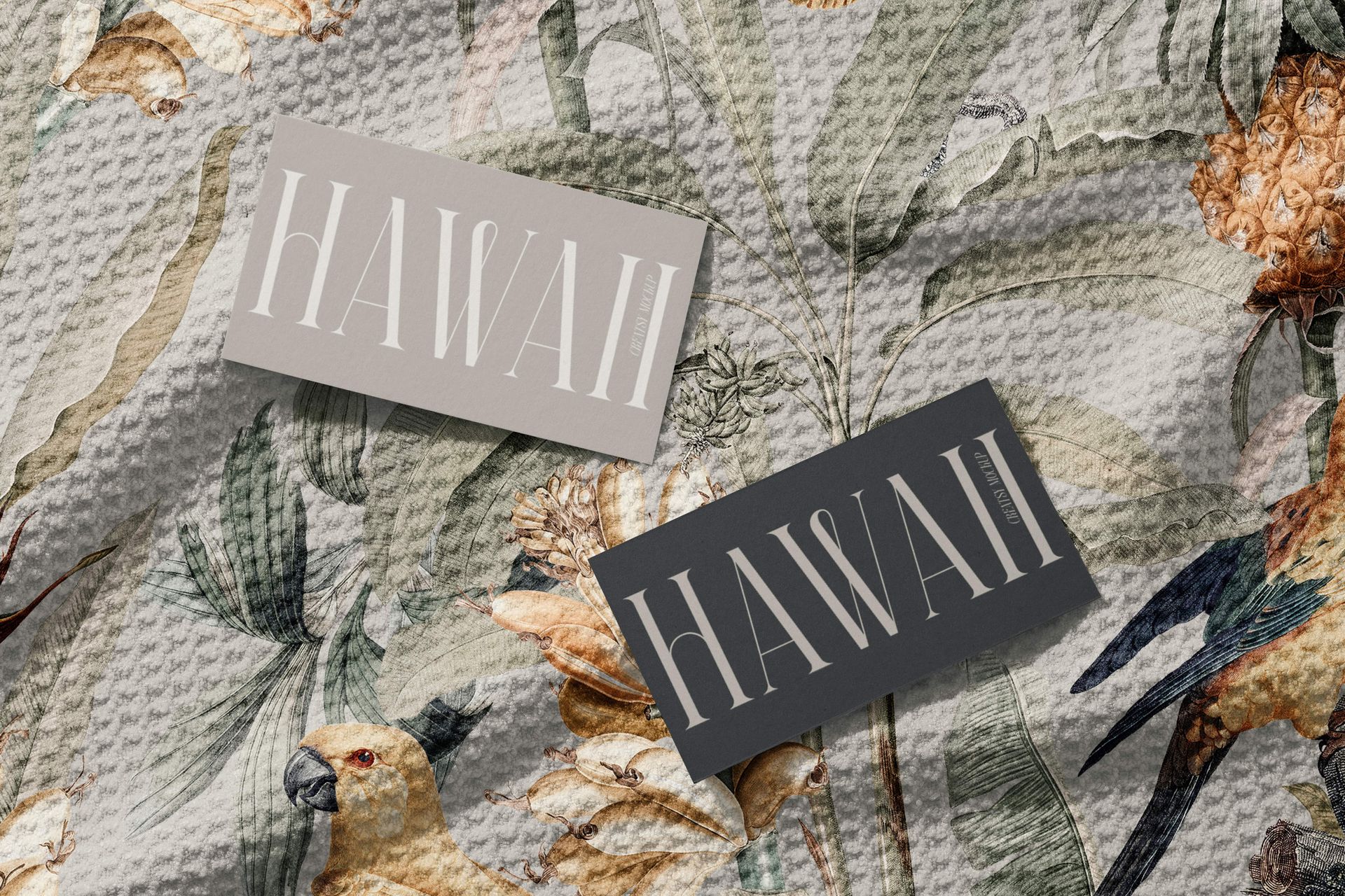 PSD mockup showing a detailed view of a patterned waffle beach towel, decorated with flowers and birds, and two 'HAWAII' cards.