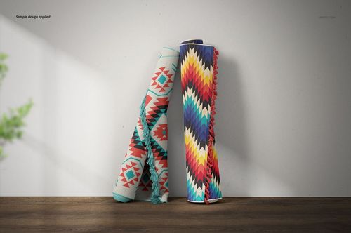 Fringed rugs mockup showing two rugs with bold, angular designs and shadows, placed upright against a neutral wall.