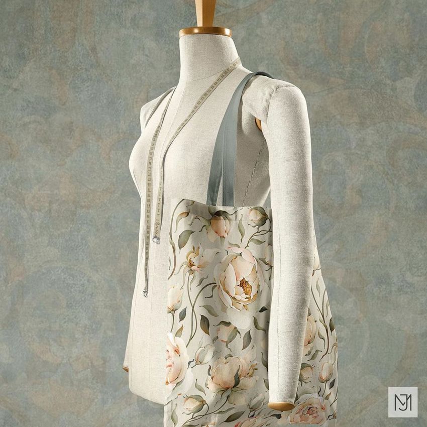 Tote bag mockup featuring a floral rose pattern, displayed on a dress form with a measuring tape draped around the neck.