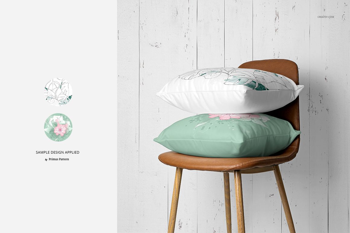 PSD mockup showing two pillows with pastel floral prints on a wooden chair, set in a minimalist home interior scene.