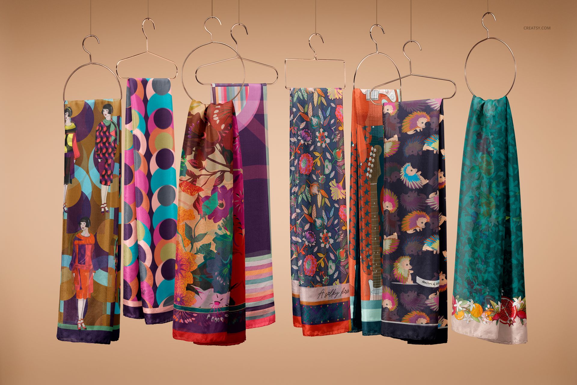 Assorted colorful habotai silk scarves displayed on hangers, showcasing various floral and abstract designs in a mockup scene.