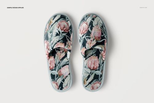 Home slippers mockup featuring a botanical design with large pink flowers and green leaves, viewed from above.