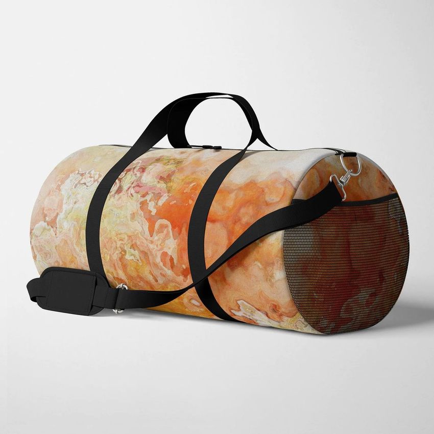 Polyester duffel bag mockup featuring an abstract orange and beige marbled pattern, shown at an angle on a plain light background.