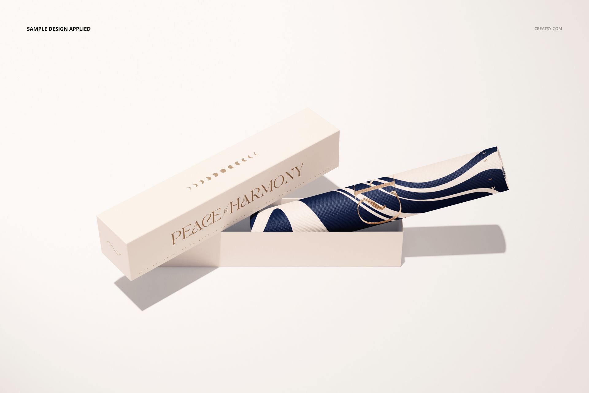 Yoga mat mockup featuring a rolled mat with wavy blue and white design, next to a rectangular packaging box.