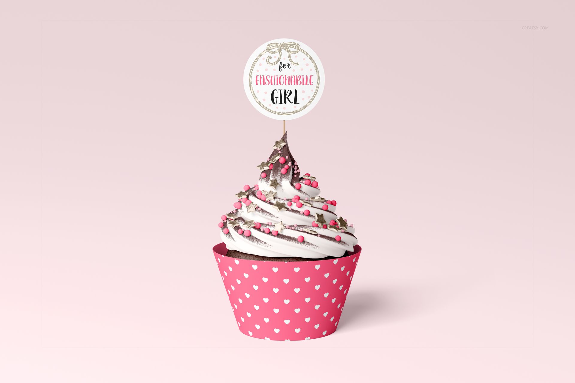 PSD mockup of a decorated cupcake with heart-patterned wrap and topper, displayed against a pastel pink backdrop.