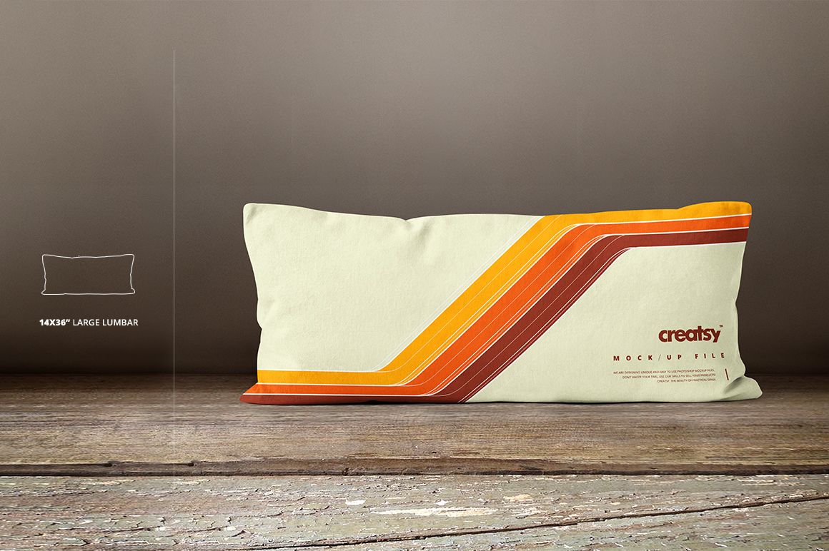 Large lumbar pillow mockup with cream fabric, featuring diagonal orange and brown stripes, front view on wooden floor.