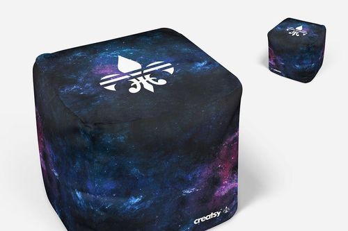 Front view of two ottoman cubes with a galaxy pattern and white emblem on white background, home decor mockup.