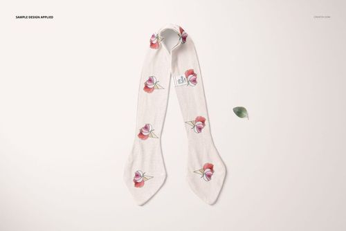 Front view of a swaddle set mockup with a soft cream fabric featuring pink floral patterns and a small tag.