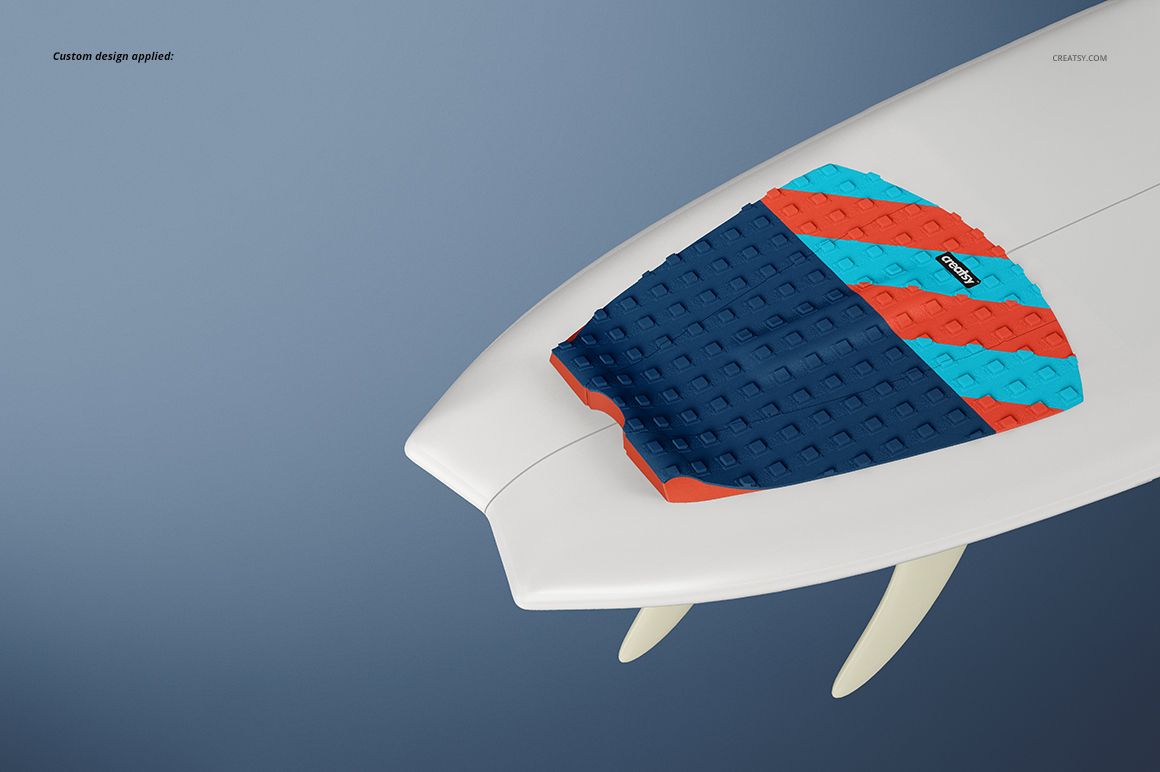 Mockup of a surfboard traction pad featuring bold diagonal stripes in blue and orange, viewed from above.
