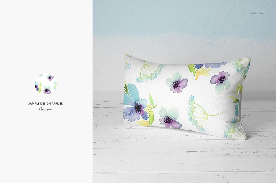 PSD mockup of a rectangular pillow featuring soft watercolor flowers in pastel shades, placed on a light wood surface.