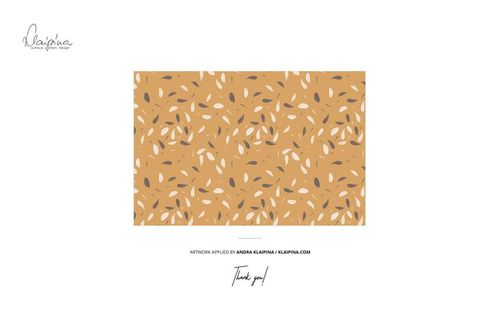 Rolled cotton fabric mockup featuring a scattered leaf design in earthy colors, displayed on a white background.