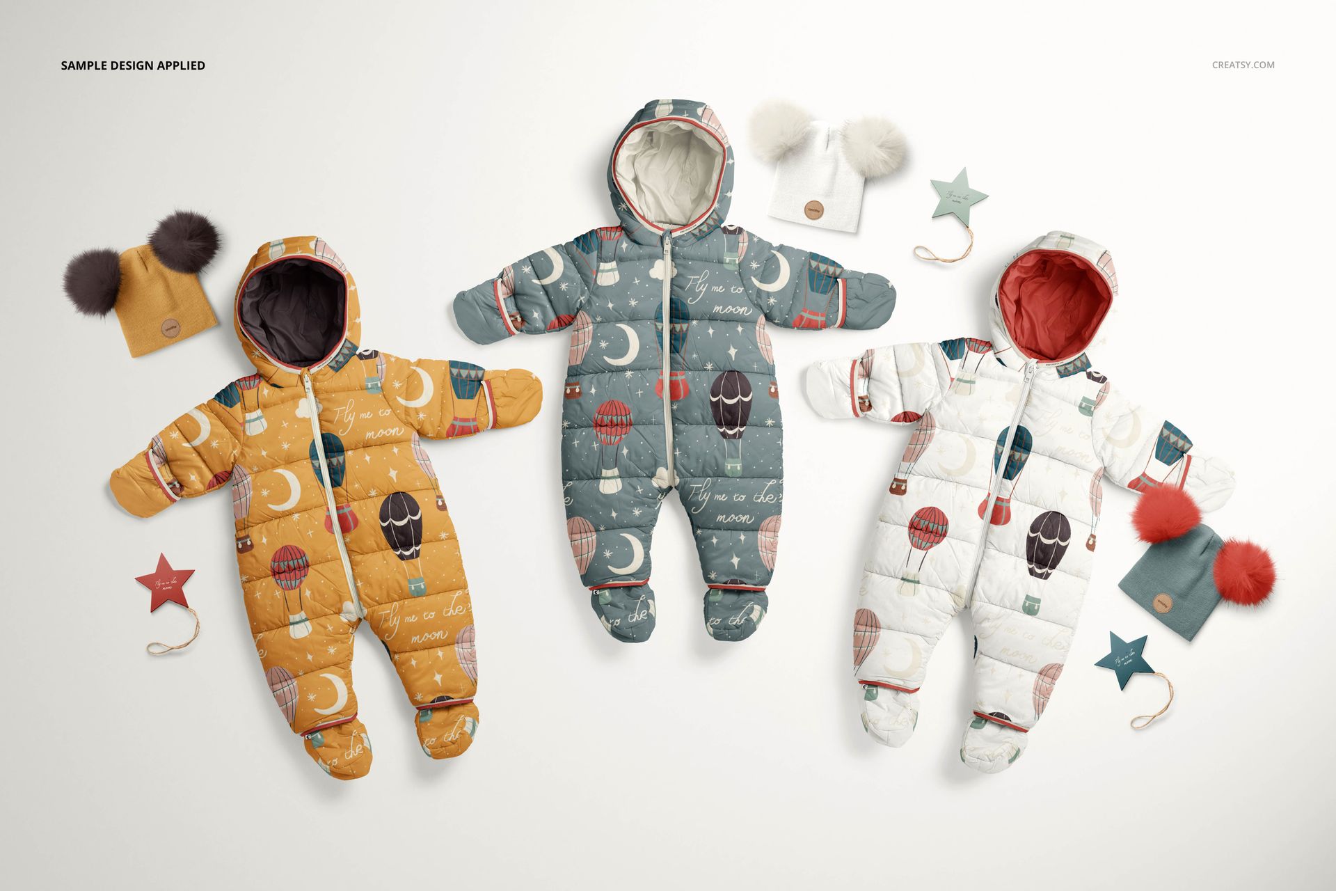 Flat lay of baby snowsuits mockup set featuring playful designs and accessories on a white background.