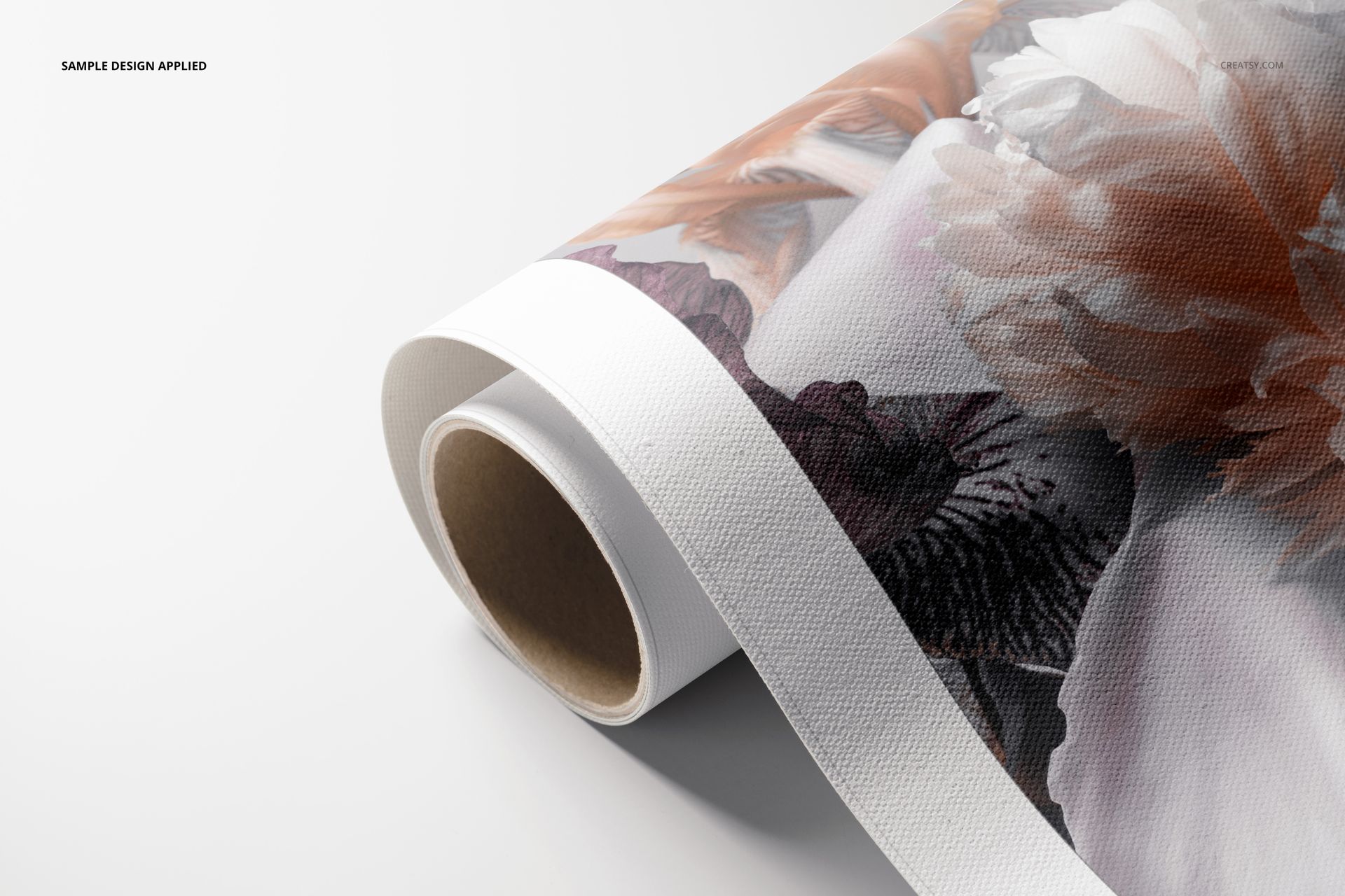 Close-up of a rolled canvas print mockup with textured surface and colorful floral artwork on a plain background.