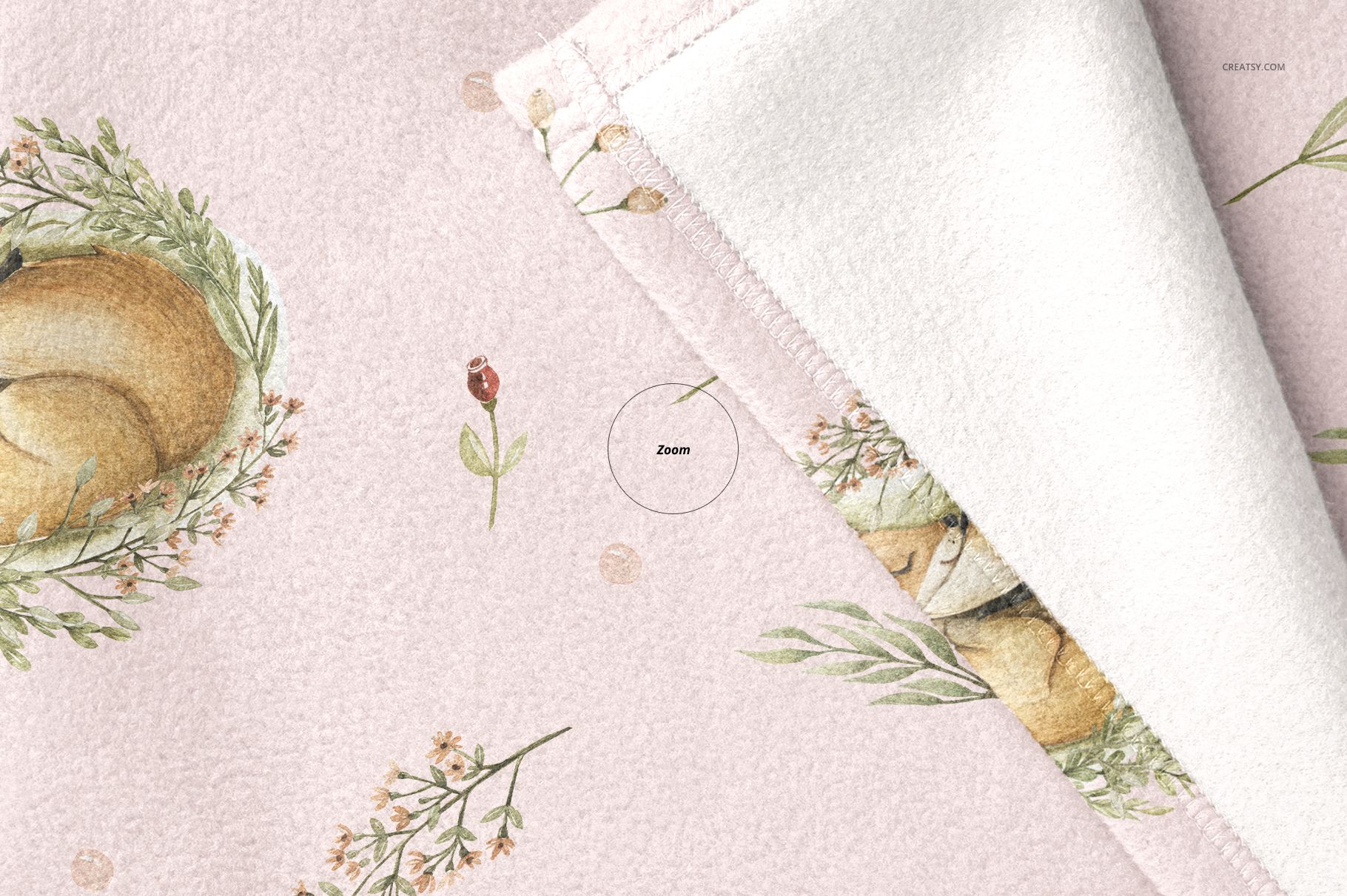 Soft fleece baby blanket mockup with a pastel pink surface, featuring animal and floral illustrations, shown in close-up view.