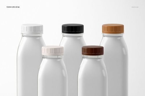 Set of five glass bottles arranged in a row, each with a distinct cap color, displayed in a PSD mockup format.