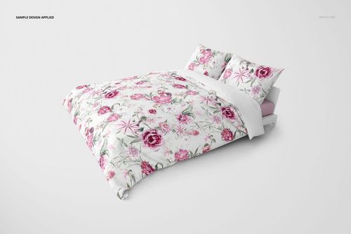 Front view of a bedding set mockup featuring a duvet and two pillows with a pink floral pattern on white background.
