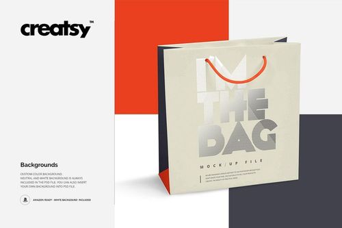 Paper bag mockup featuring a beige bag with metallic text and red handles, displayed on color block backgrounds.