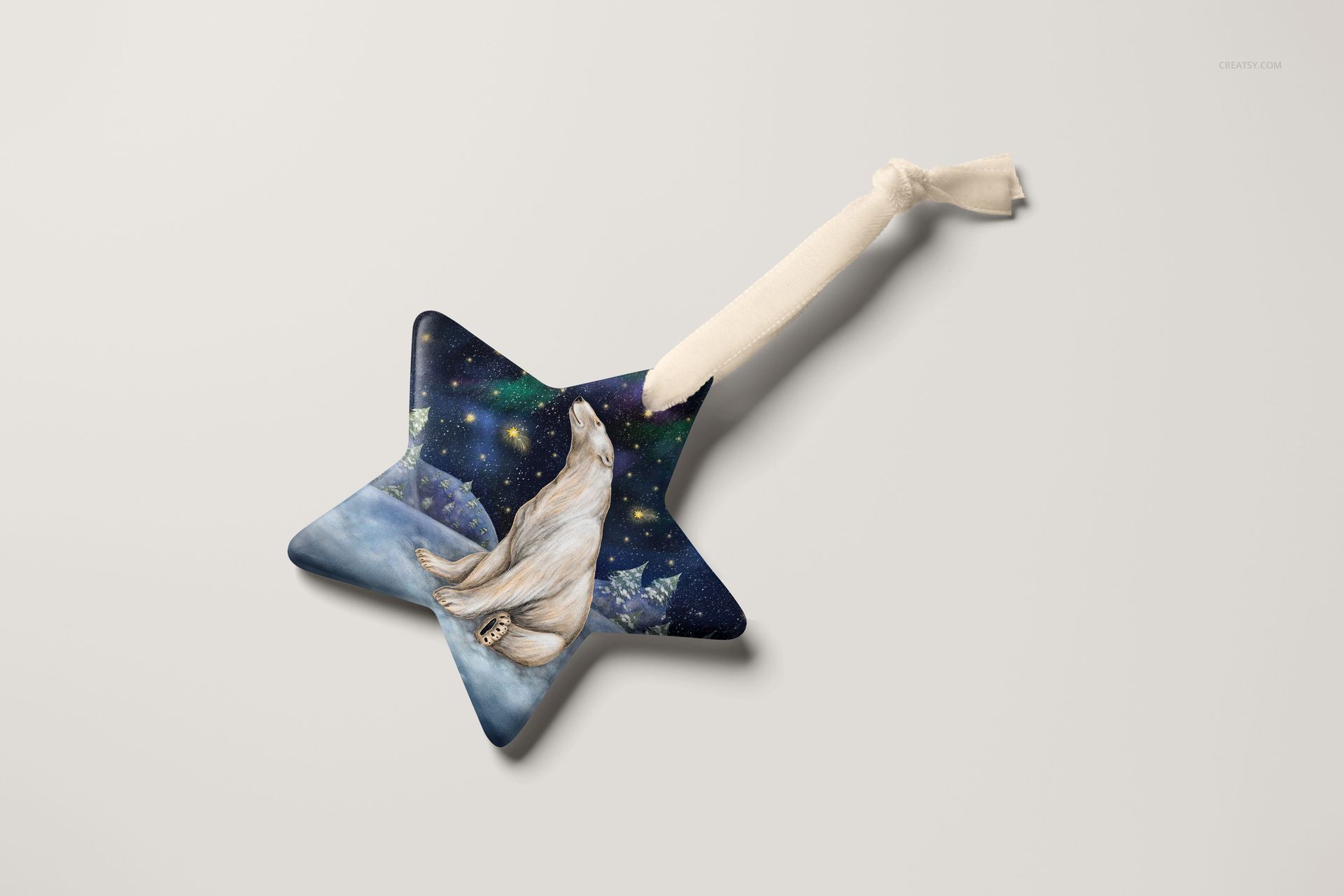 Star-shaped Christmas ornament mockup featuring a polar bear illustration on a dark blue and green patterned background.