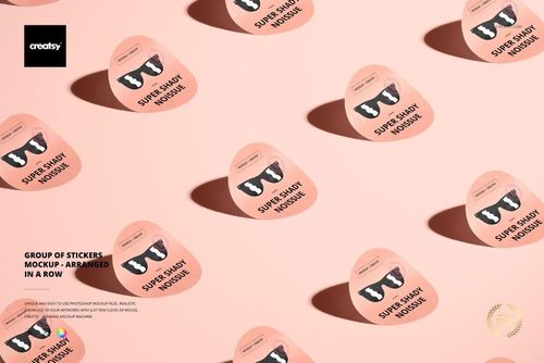 PSD mockup showing several round stickers with animal designs and text, organized diagonally across a flat surface.