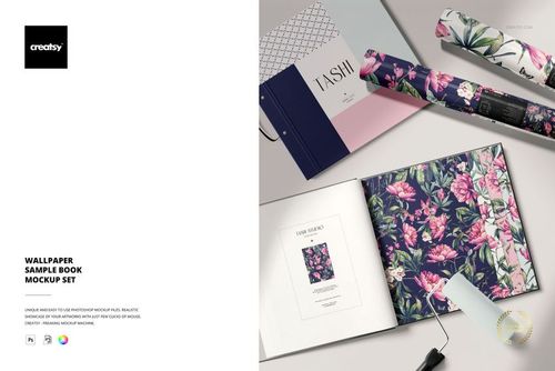 Open wallpaper sample book mockup set with floral patterned pages, rolled wallpaper samples, and a tape measure on a beige surface.